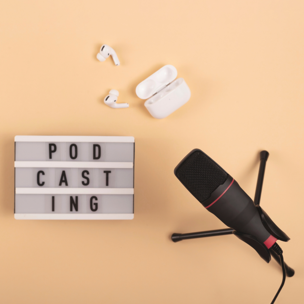 Podcast microphone, podcast sign and airpods