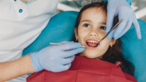 Young girl getting dental exam